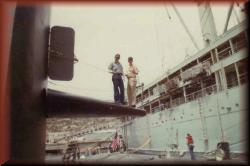 Chief Standlee and QM striker on the fairwaters in La Maddelena, Sardinia